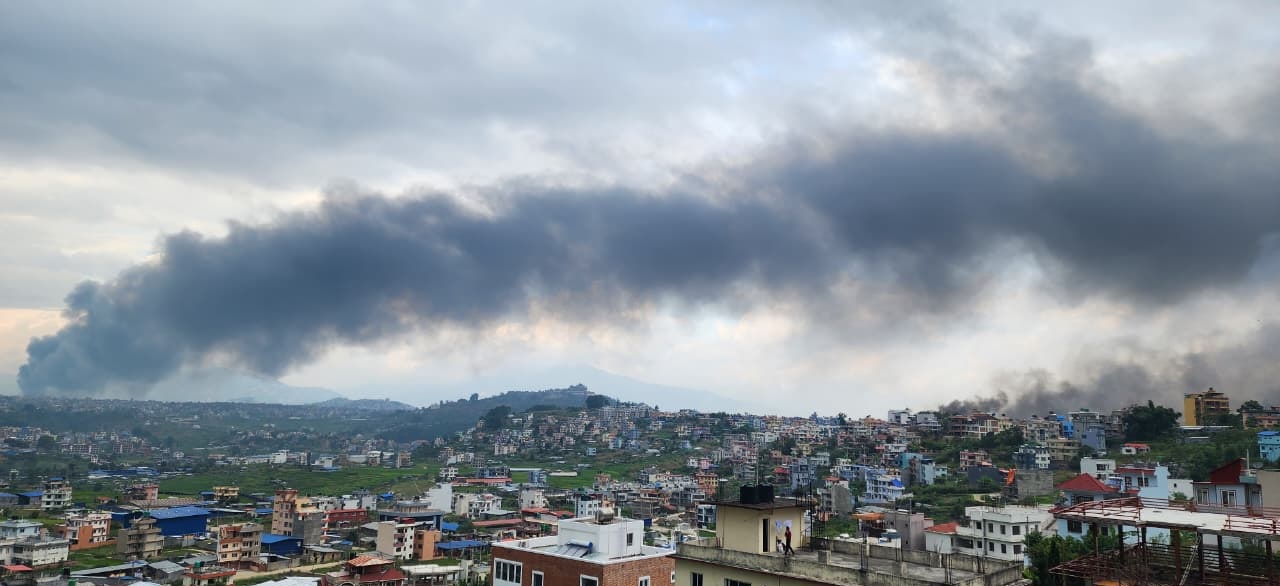 Kathmandu is burning. Lalu shared a photo showing the view from their shelter.