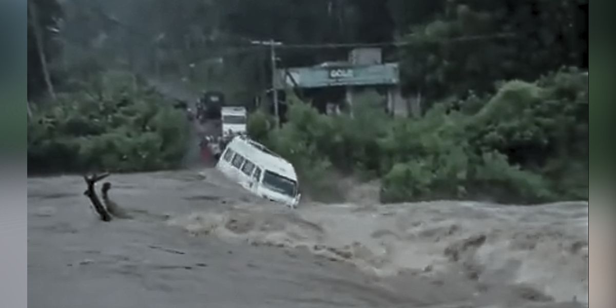 A vehicle washed away following the heavy rains in Idukki.