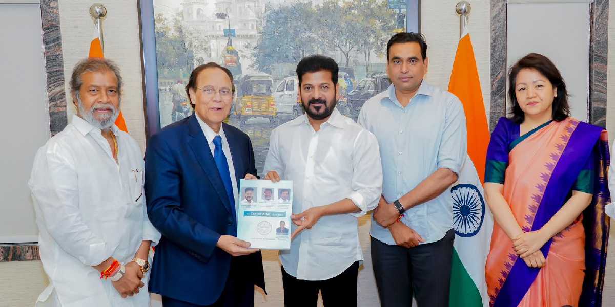 Telangana CM Revanth Reddy with a cancer report