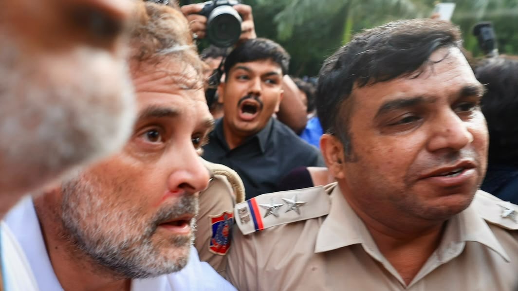 Rahul Gandhi is seen with a nosebleed while being dragged away by Delhi Police.