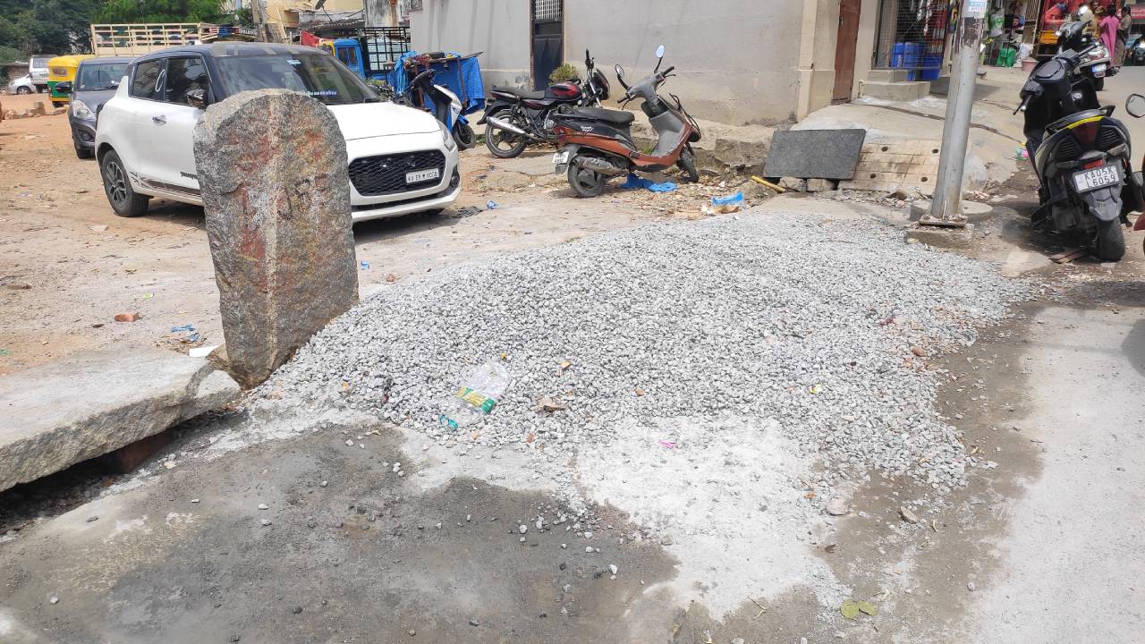 Bengaluru, 6 July: Gravel strewn around tests the stability of pedestrians taking this footpath in Jayanagar.