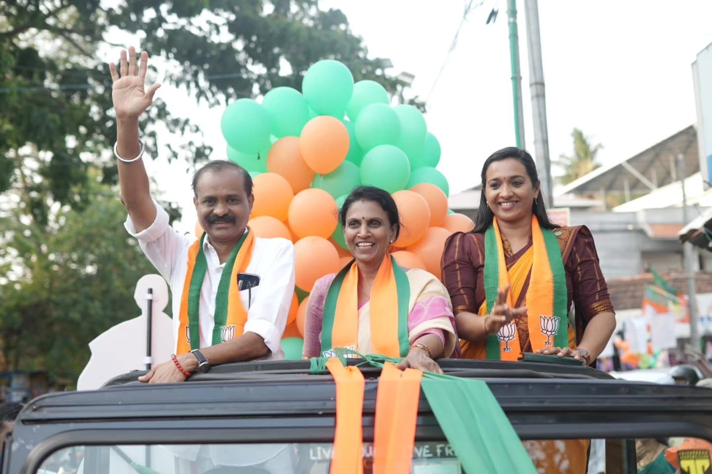 R Sreelekha flanked by Mayor VV Rajesh and Deputy Mayor Asha Nath GS
