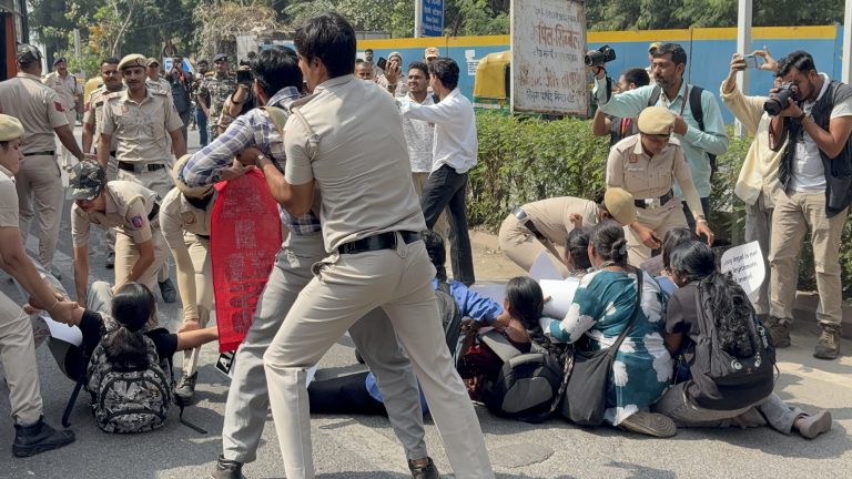 Police whisked away the detained students on waiting buses.