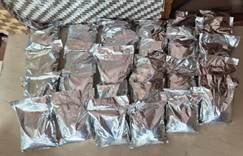 Multiple silver-foil-wrapped packets containing suspected crystal methamphetamine seized in Nagapattinam district.