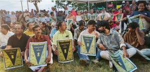 People holding symbolic copies of the Constitution