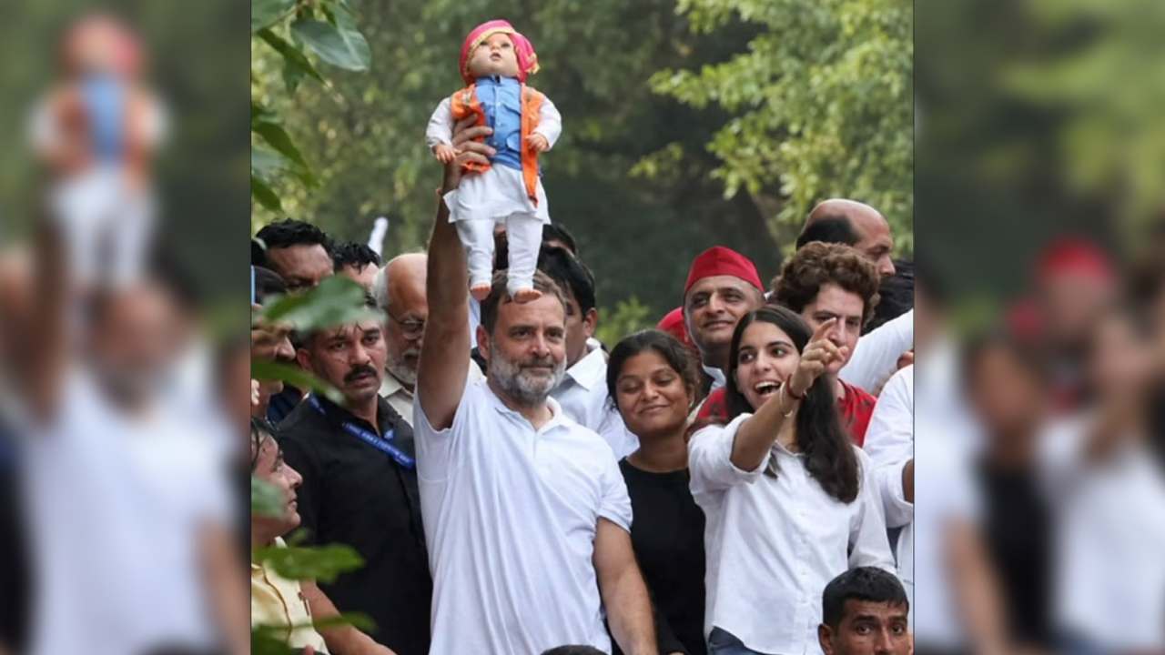 Rahul Gandhi holds up a doll during the INDIA bloc's anti-SIR march to the Supreme Court on Monday. The INC suggested the doll represented PM Modi.