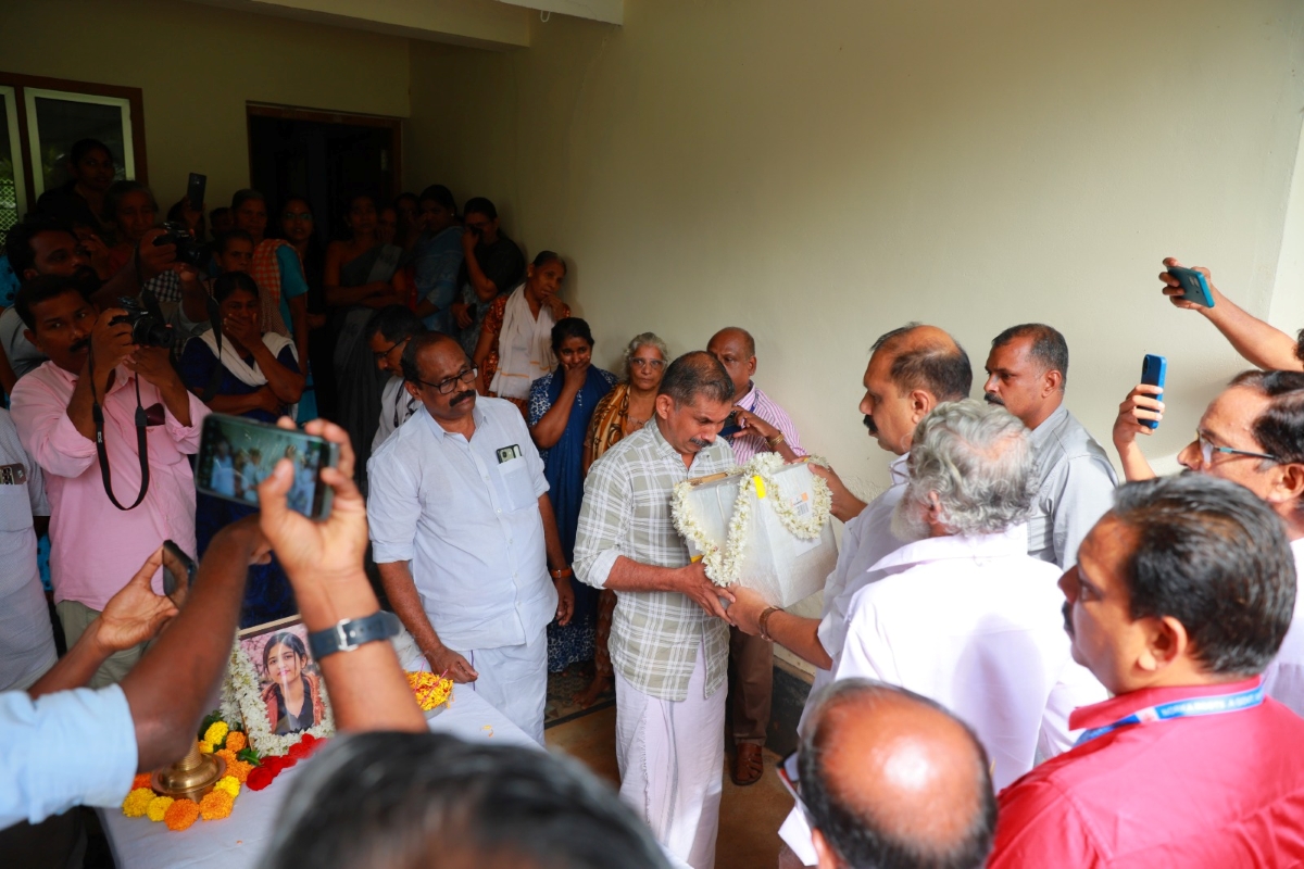 Sajeev Joseph MLA handing over the ashes to Devika’s father, Prakashan.