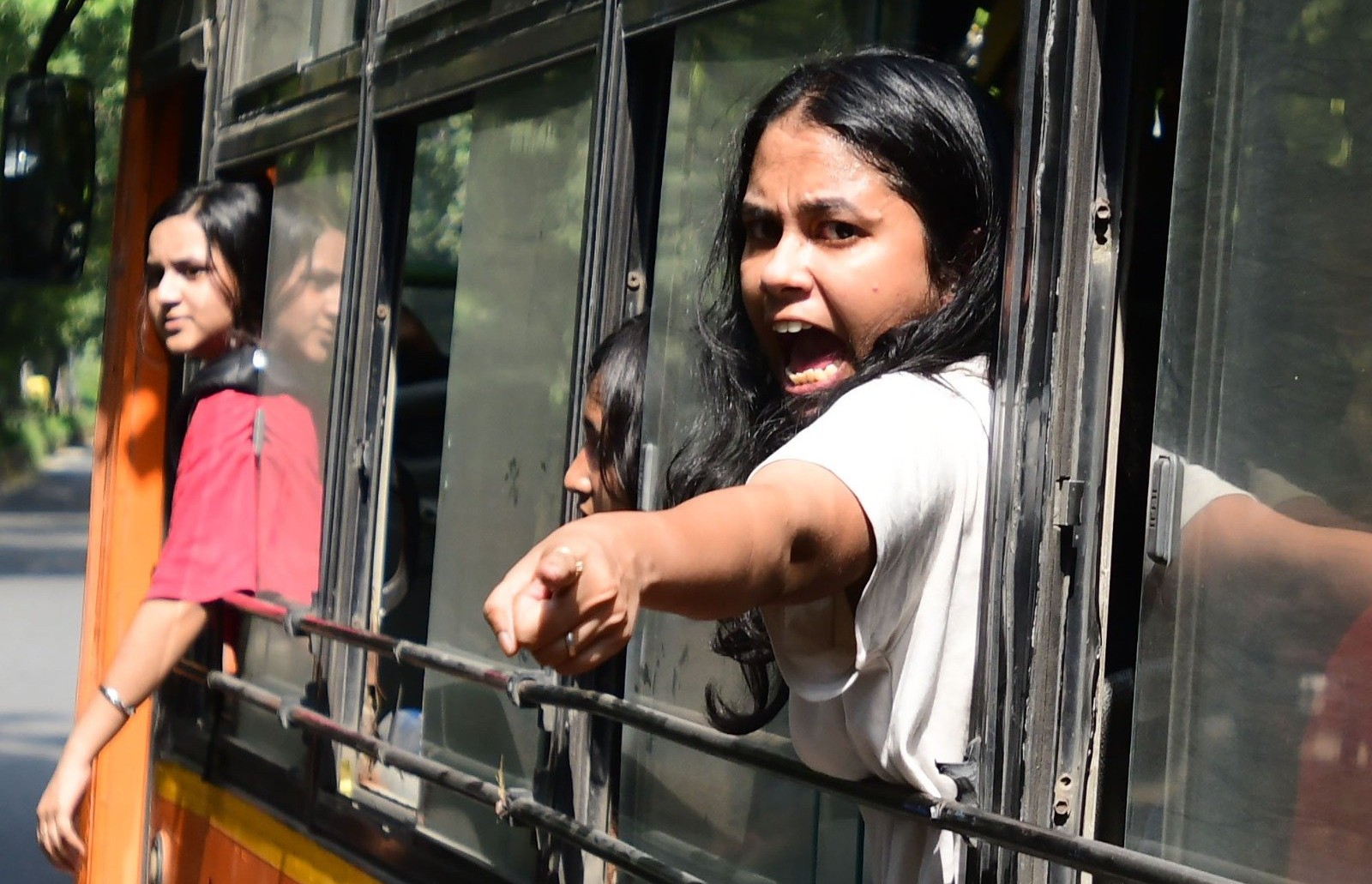 Students being whisked away to detention centres in Delhi on Saturday.