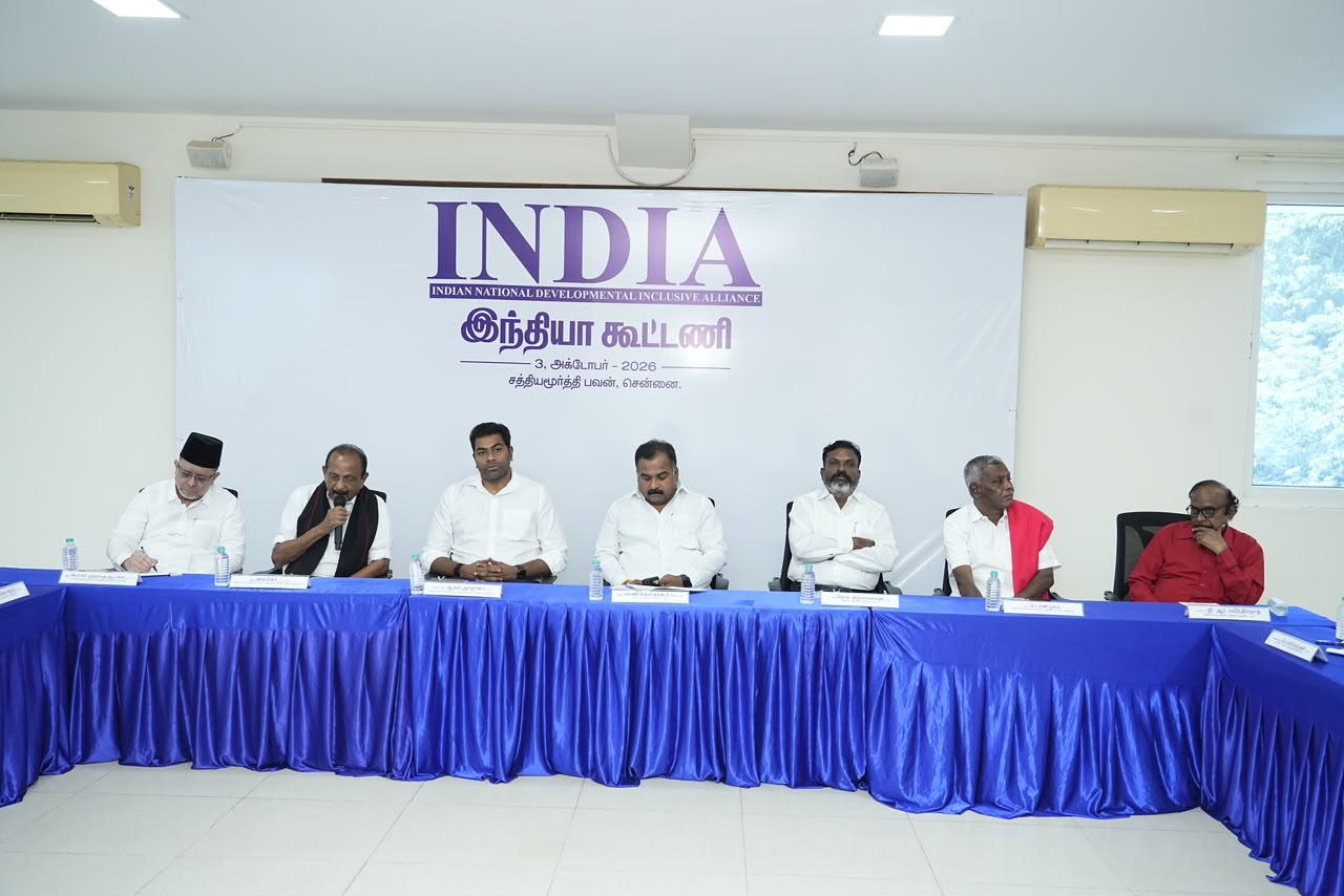 Leaders of INDIA bloc parties seated at a meeting in Chennai, with an INDIA alliance banner displayed behind them.