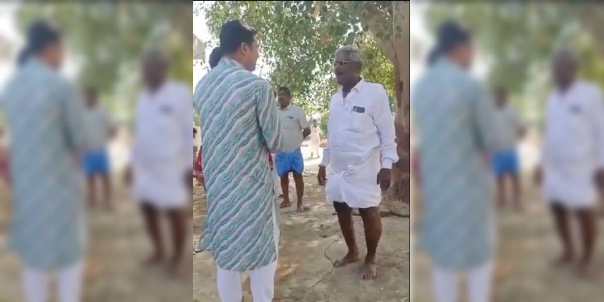 Sudheer being confronted by upper caste village elders (screengrab)